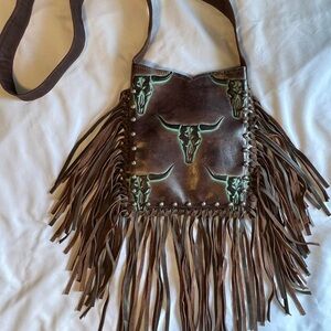 Raviani Crossbody Bag with Fringe and Bull Skull